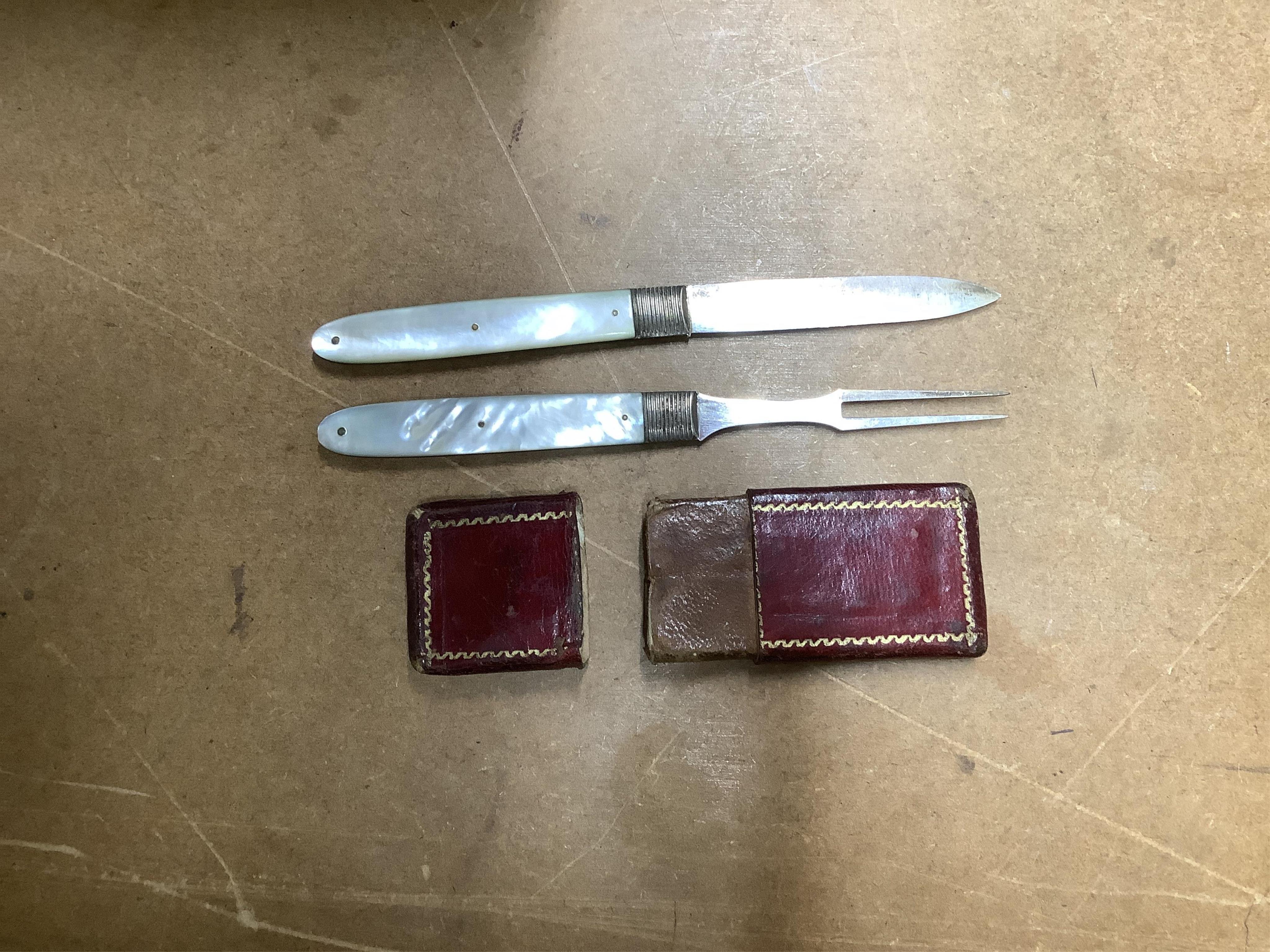 A George V silver mounted glass whisky noggin, by Hukin & Heath, Birmingham, 1911, 10.5cm, together with a Georgian cased mother of pearl handled silver travelling knife and fork set and a cased set of six George VI silv